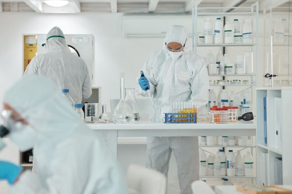 Laboratory technician pipetting samples for analytical testing in a cell and gene therapy quality control lab